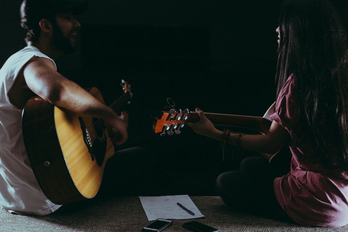 Two Mates playing guitar together during a music Hangout
