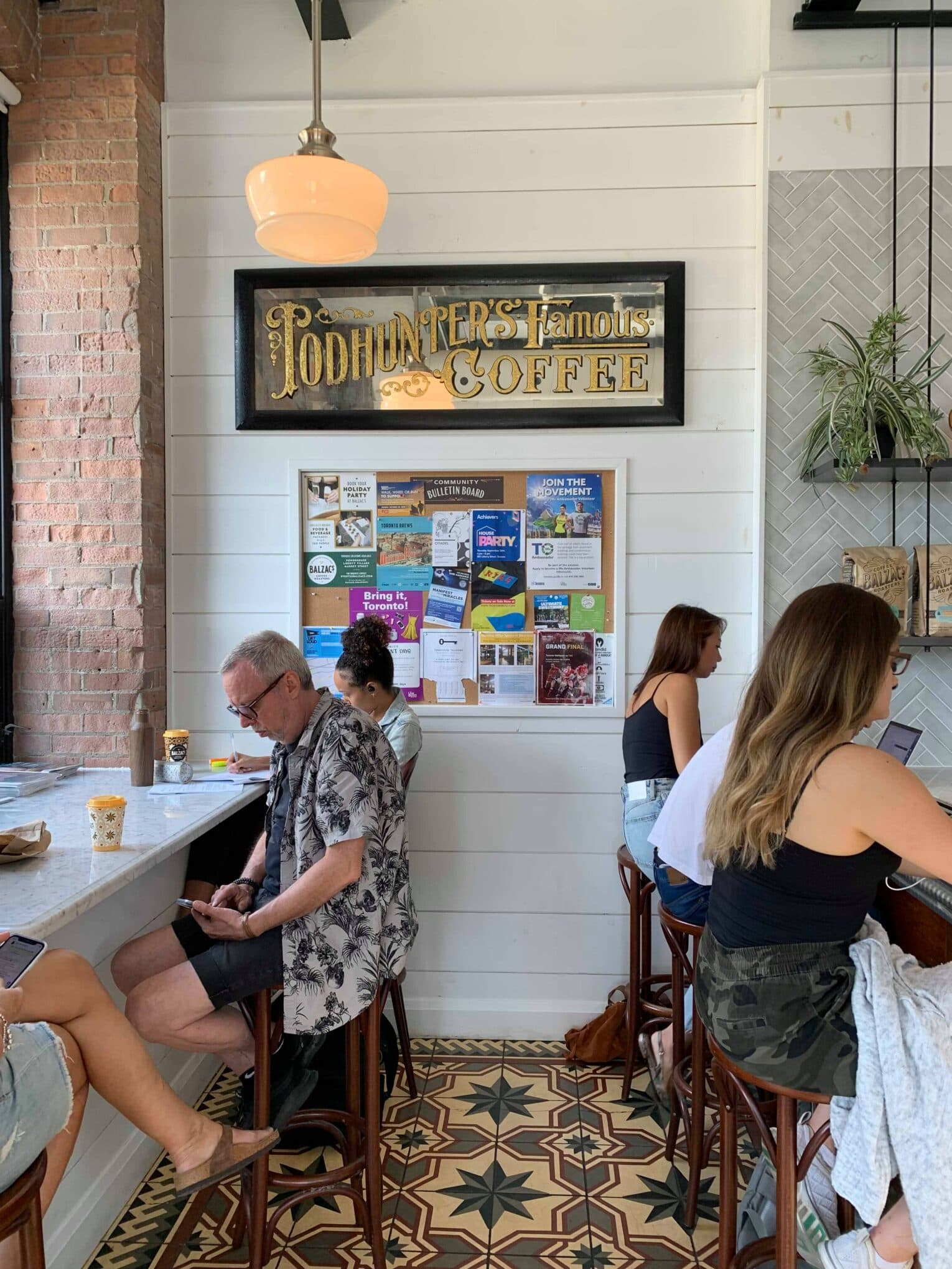 Neighbours meeting up inside a local Liberty Village café
